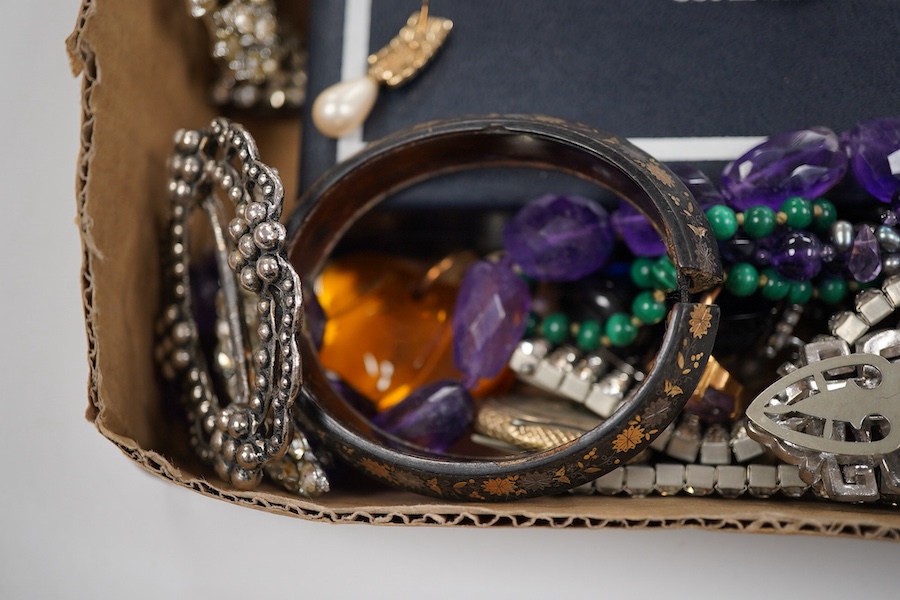A collection of costume jewellery to include a yellow metal and amethyst ring, two George V silver and guilloche enamel brooches, two amethyst necklaces, etc